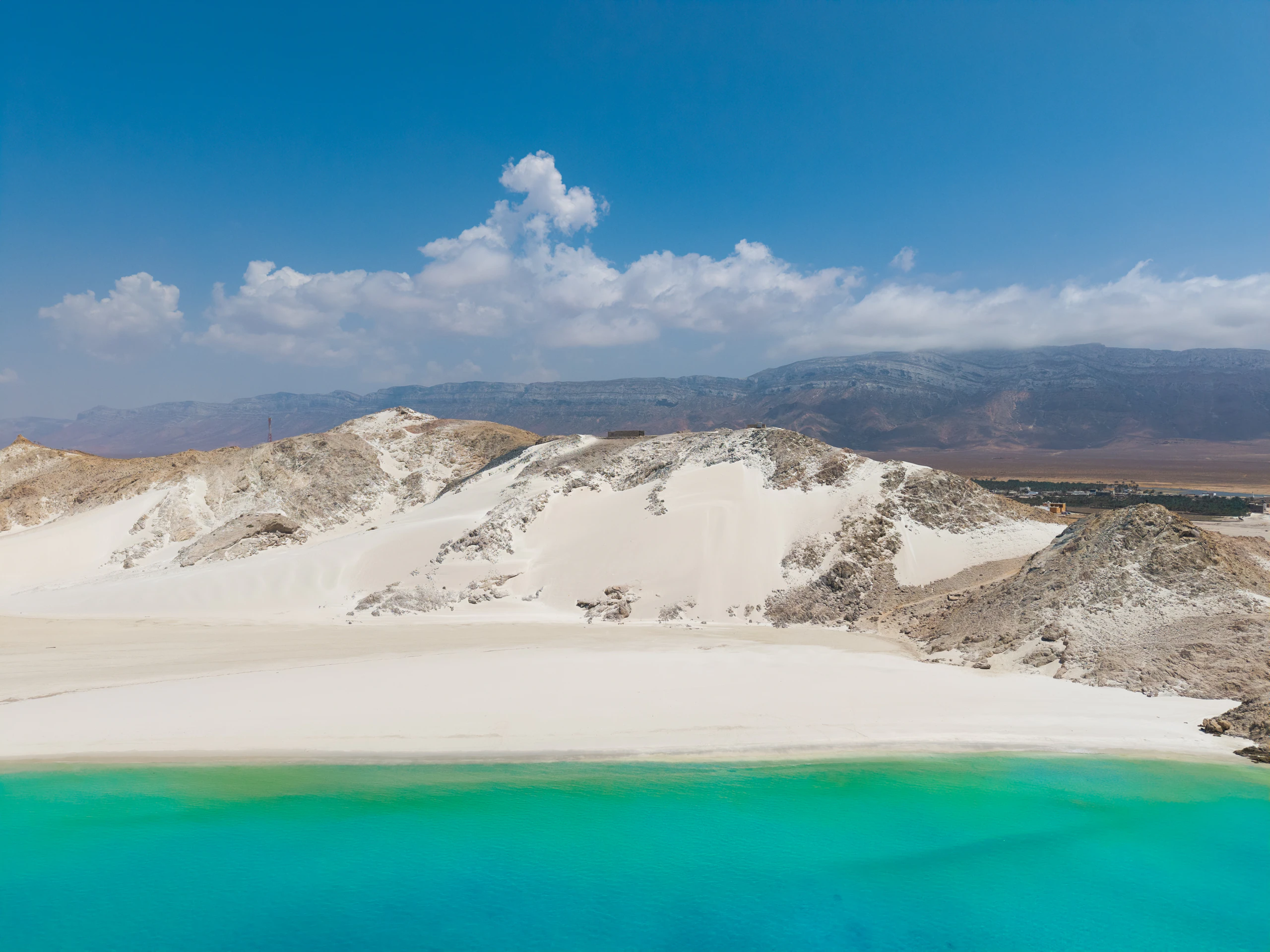 Wide shot of white dunes at Detwah Lagoon under an empty sky